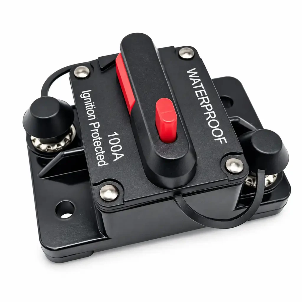 Waterproof DC circuit breaker detail showing reset button and terminal connection structure